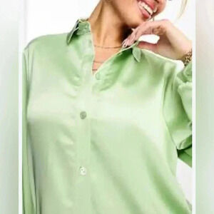 Elegant satin shirt with button in bright green color